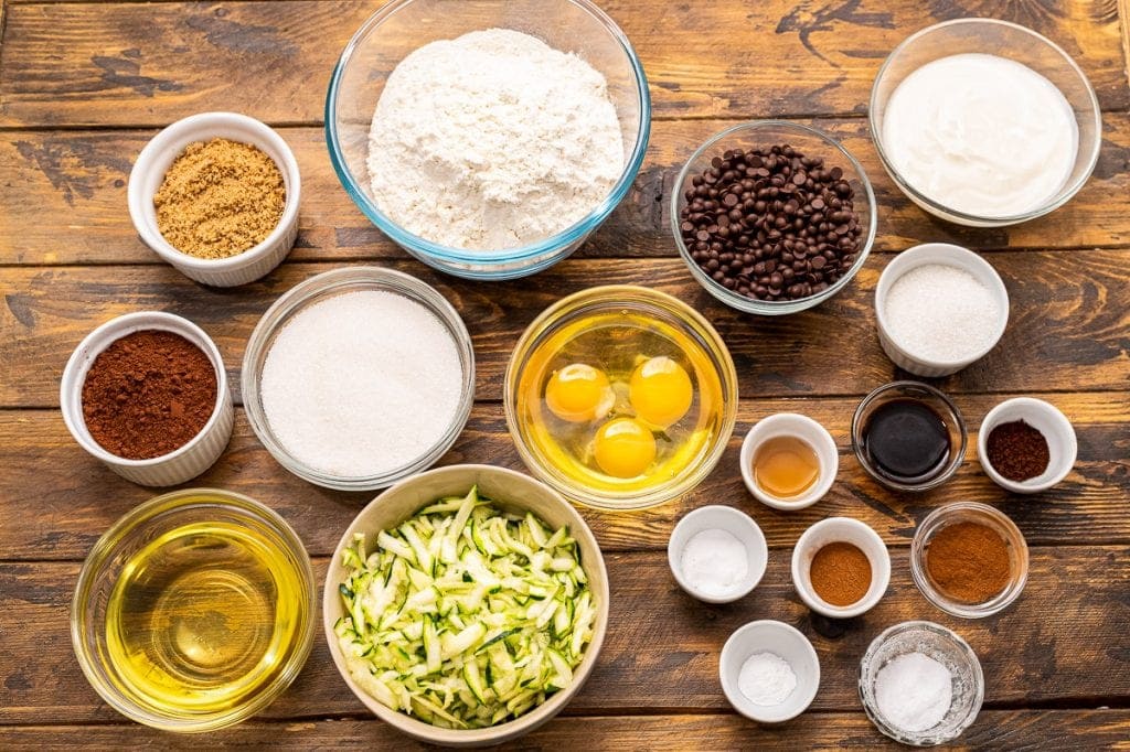 Overhead image showing ingredients in bowls for chocolate zucchini bread