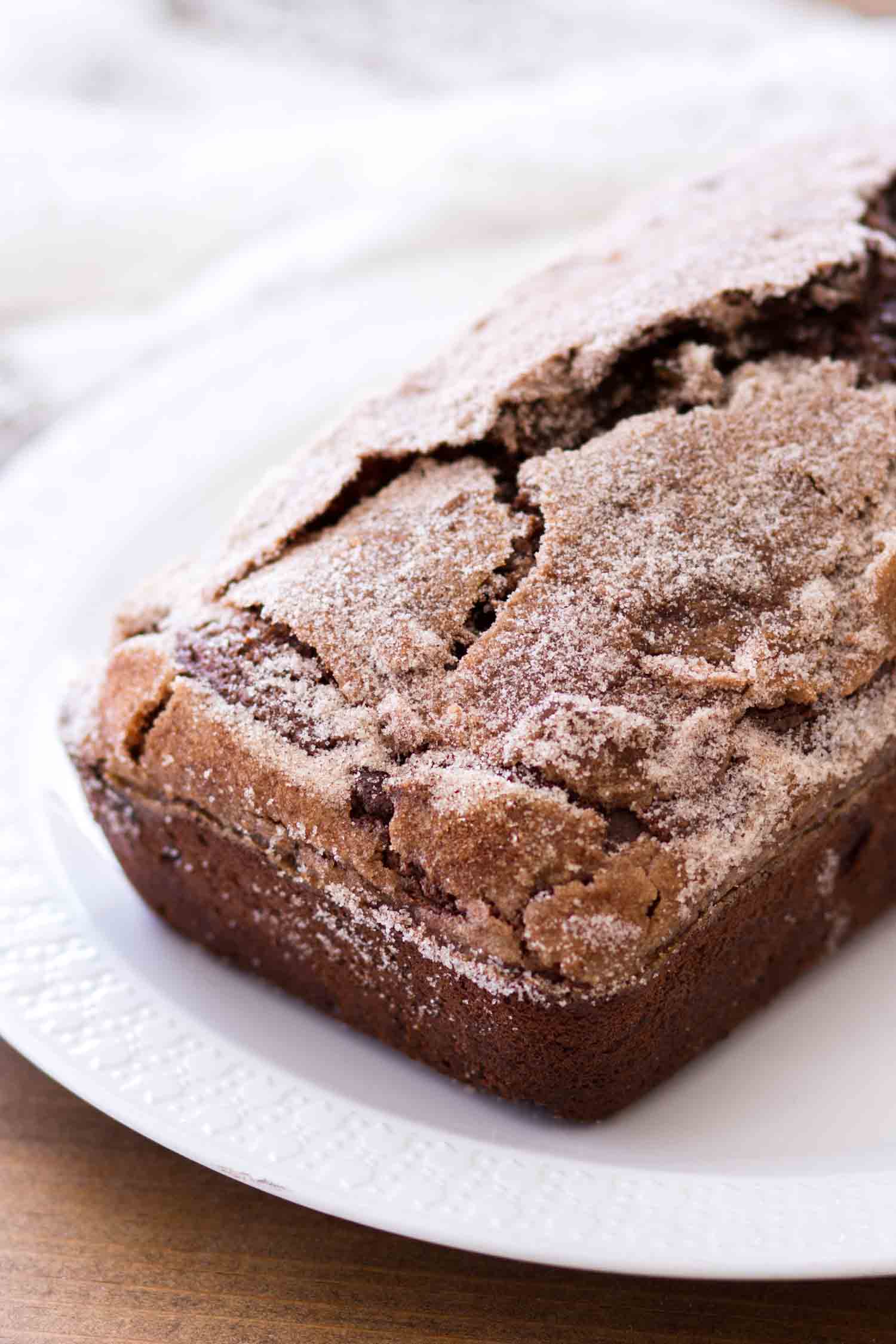 This Double Chocolate Zucchini Bread is rich, fudgy, and full of sweet chocolate flavor. Homemade zucchini bread is so simple to make and when topped with a cinnamon sugar crust, this double chocolate zucchini bread is irresistible! chocolate zucchini bread loaf