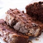 Two slices of double chocolate zucchini bread on a white plate