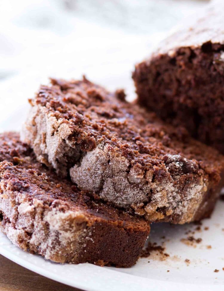 Two slices of double chocolate zucchini bread on a white plate