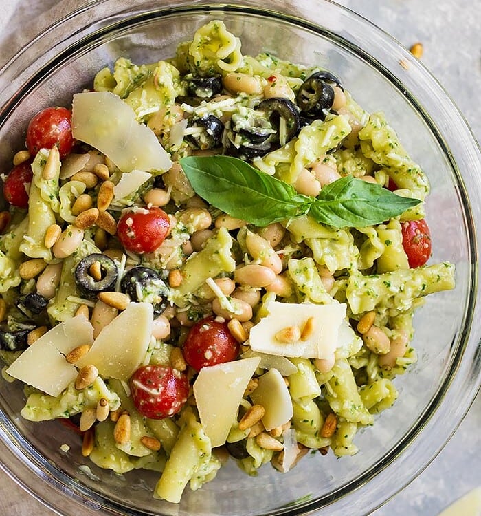 Top down view of Italian Pesto Pasta Salad in a glass bowl