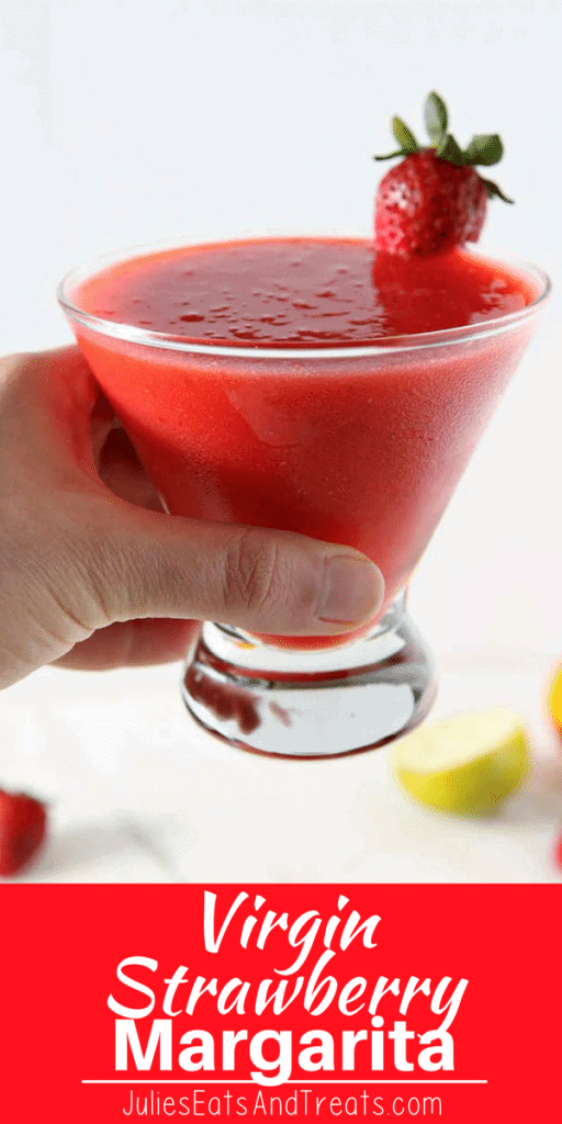 Hand holding a Virgin Strawberry Margarita in a glass
