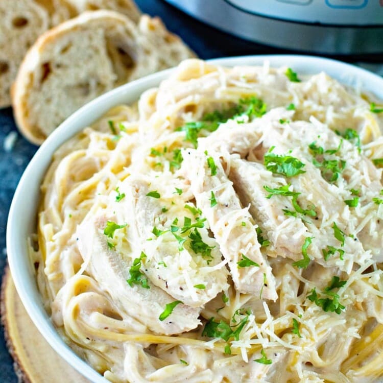 Pressure Cooker Chicken Alfredo in white bowl