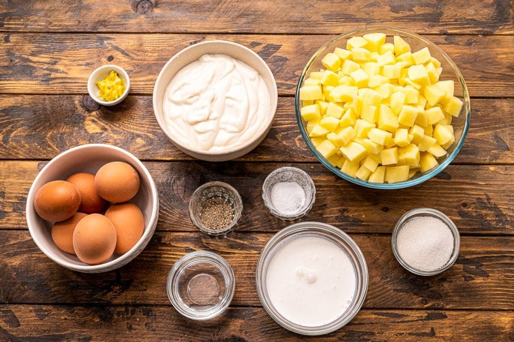 Overhead image of ingredients in bowls to make potato salad