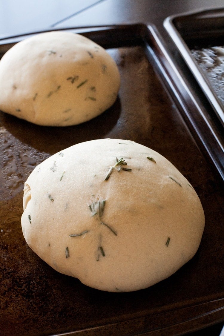 Close Up of rosemary bread dough on baking sheet