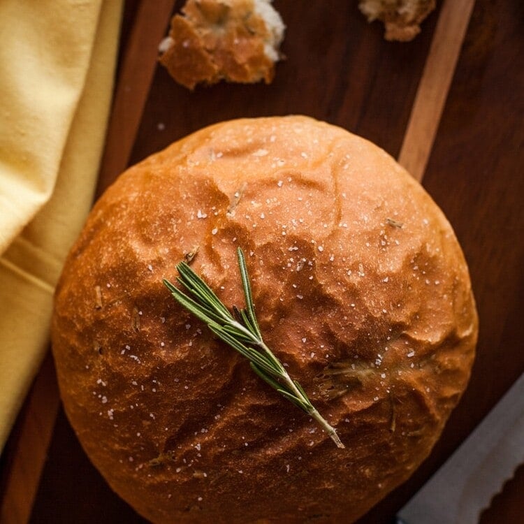 Rosemary bread loaf on a cutting board