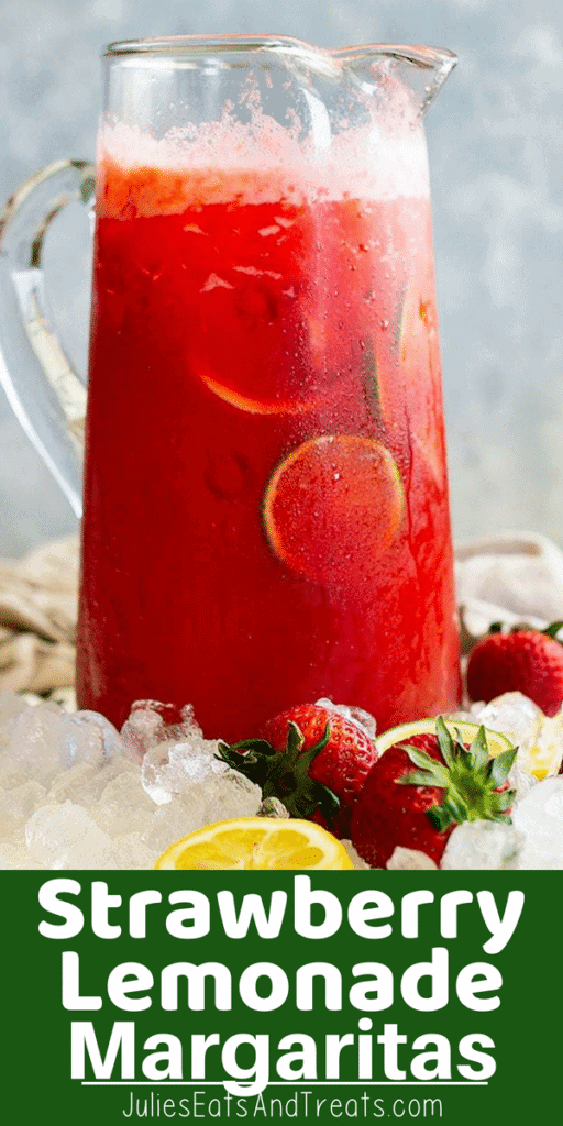 Pitcher of Strawberry Margarita Lemonade sitting on ice with strawberries and lemons