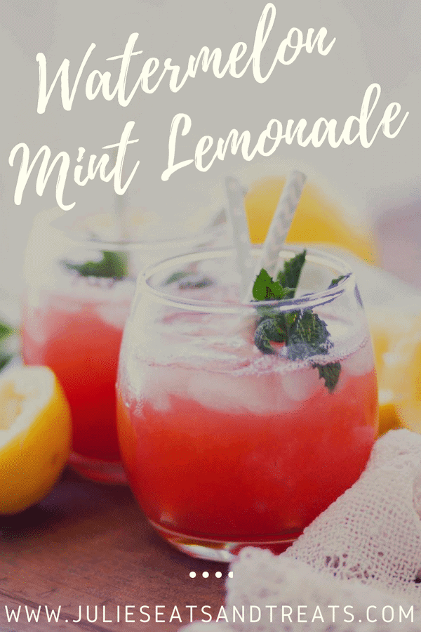 Watermelon mint lemonade in a short glass with a straw and mint