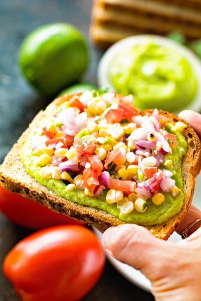 Hand holding Avocado Toast