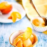 Blue background withw bowls of peach sorbet