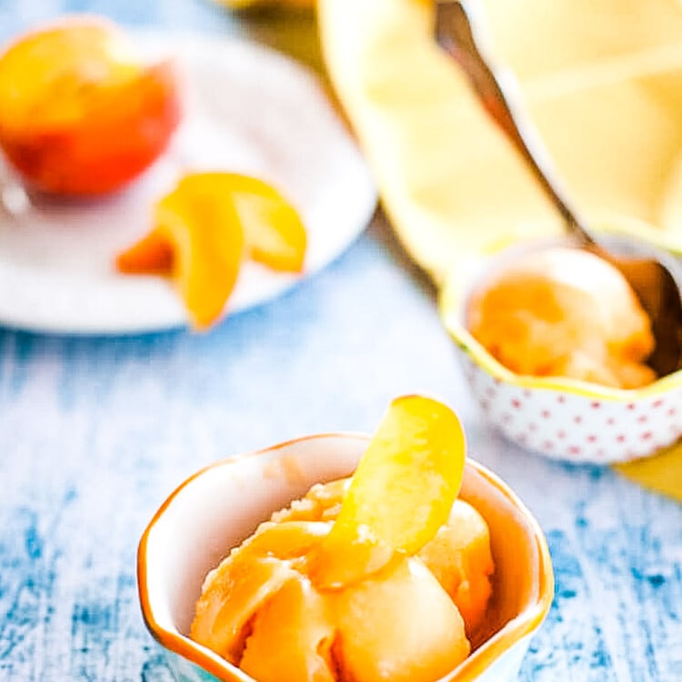 Blue background withw bowls of peach sorbet