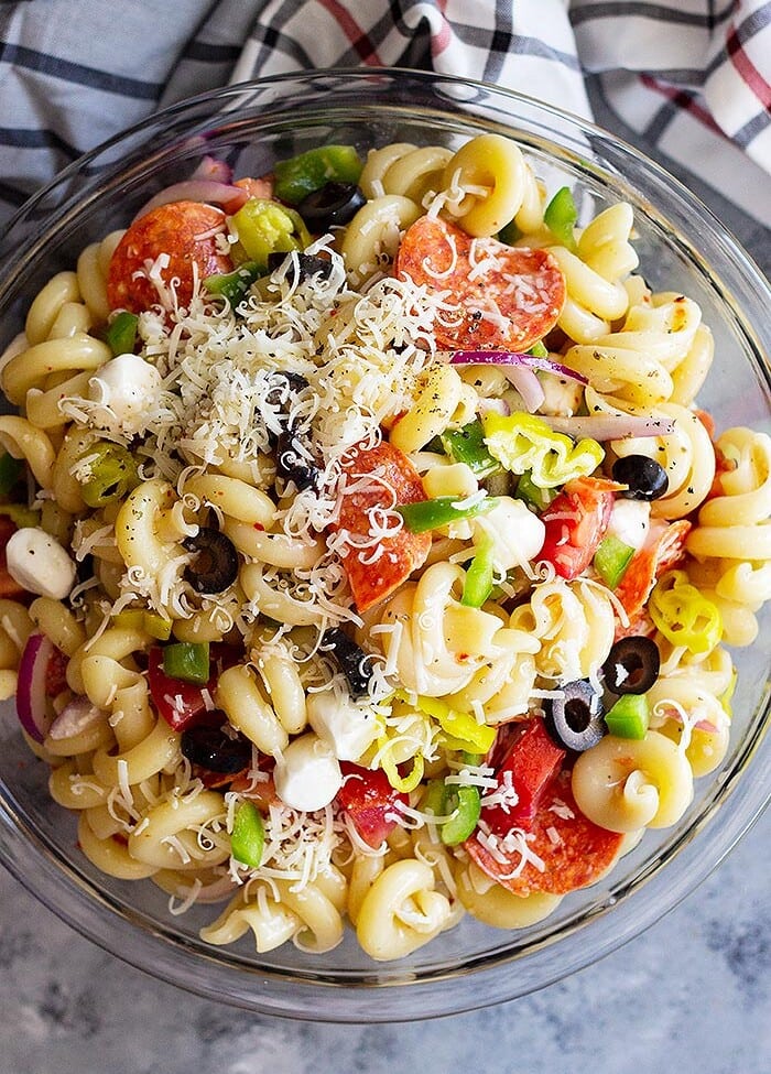 Pepperoni pasta salad in a glass mixing bowl