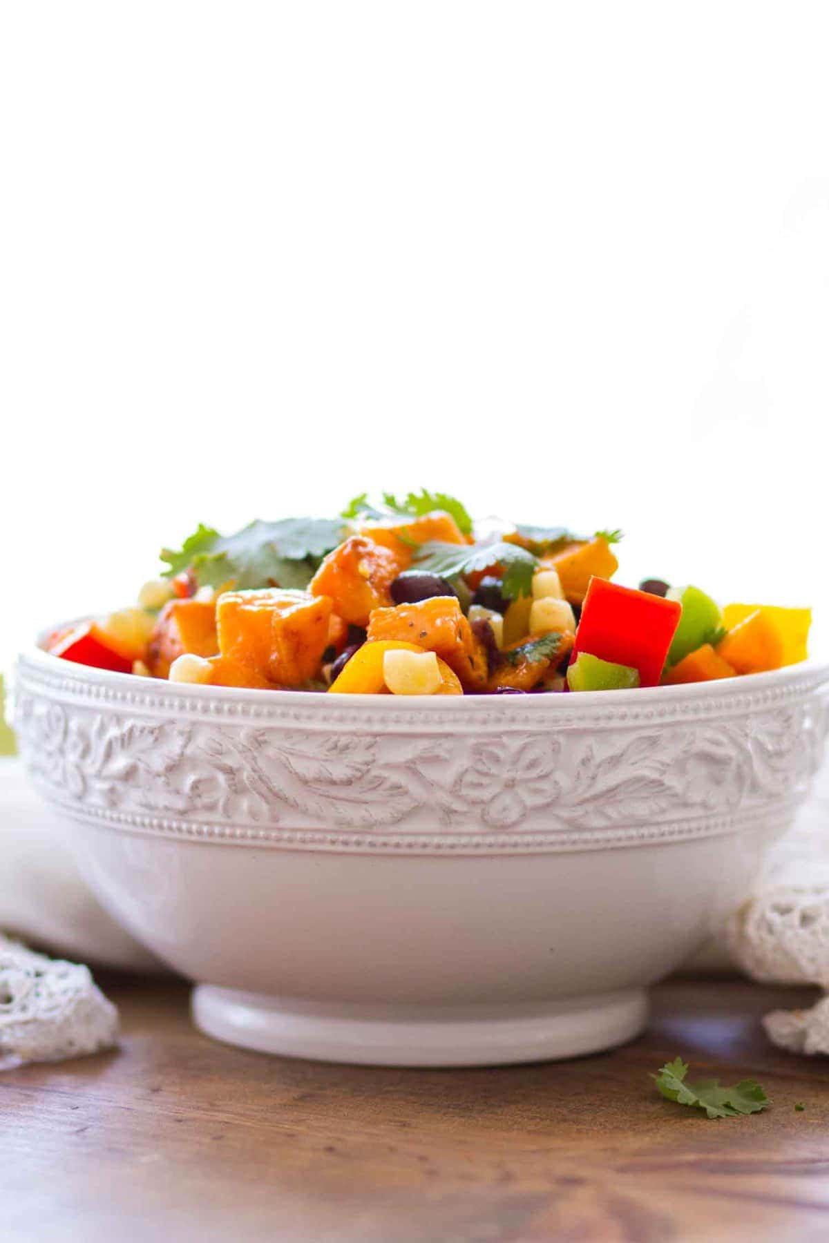 Side view of Sweet Potato Salad Recipe in white bowl