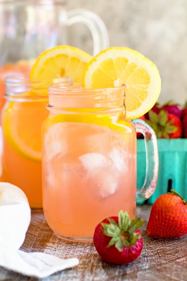 Vodka Strawberry Lemonade in Mason Jar Mug garnished with lemon slices