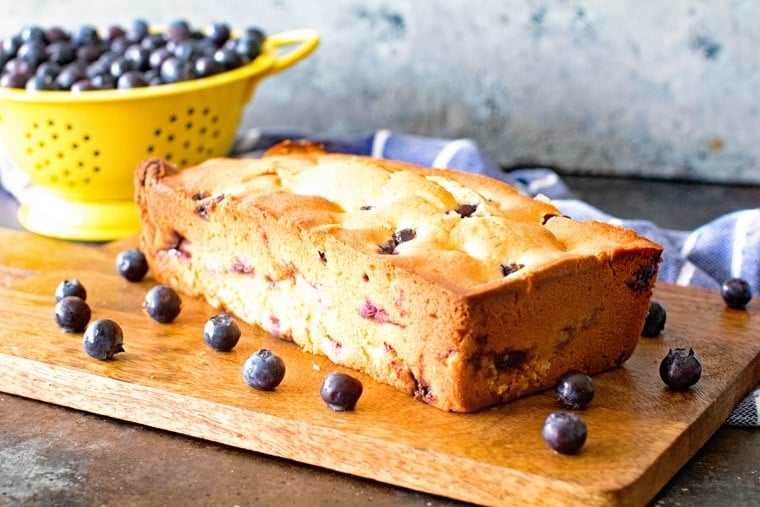 Blueberry Bread Loaf on wood cutting board