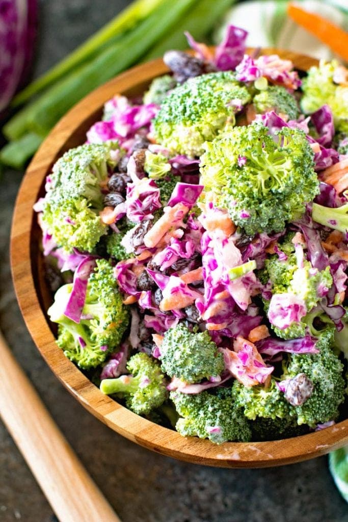 Light homemade broccoli slaw in brown bowl