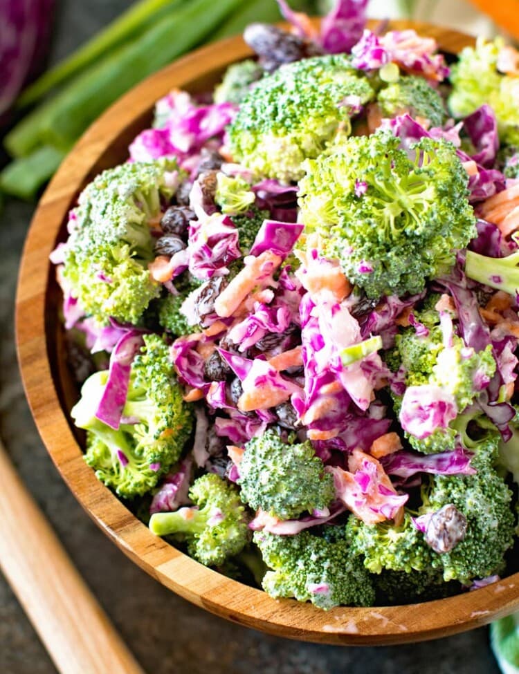 Light homemade broccoli slaw in brown bowl