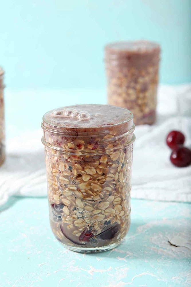 How to make Overnight Oats - Cherry Overnight Oats are filled to the brim and ready to chill in the refrigerator overnight