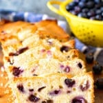 Cream Cheese blueberry bread sliced on a cutting board