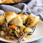 Easy skillet beef pot pie on a white plate with a fork