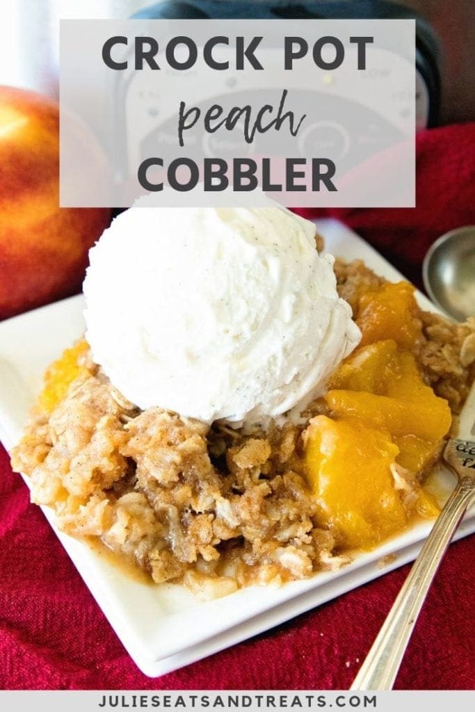 crock pot peach cobbler with vanilla ice cream on a plate