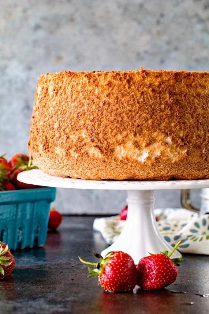 Homemade Angel Food Cake on white cake plate