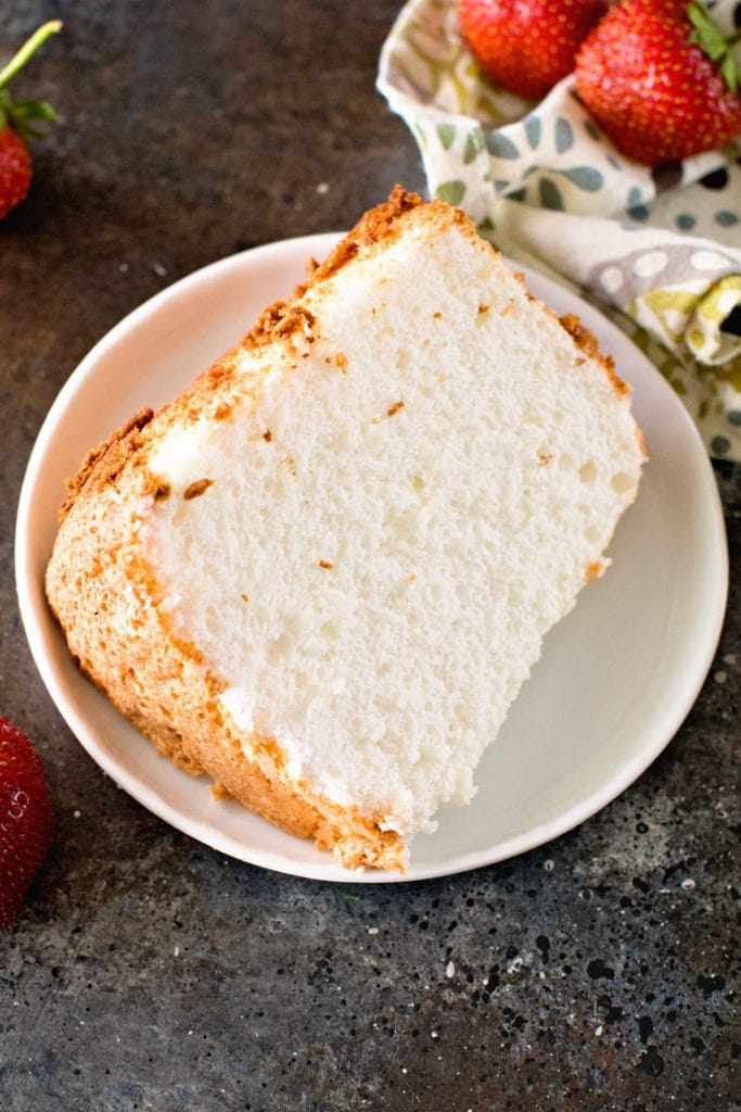 Slice of angel food cake on white plate