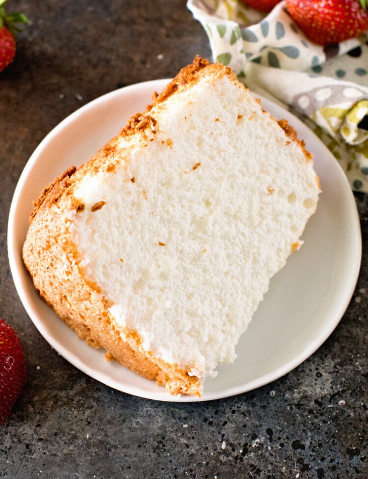 Slice of angel food cake on white plate