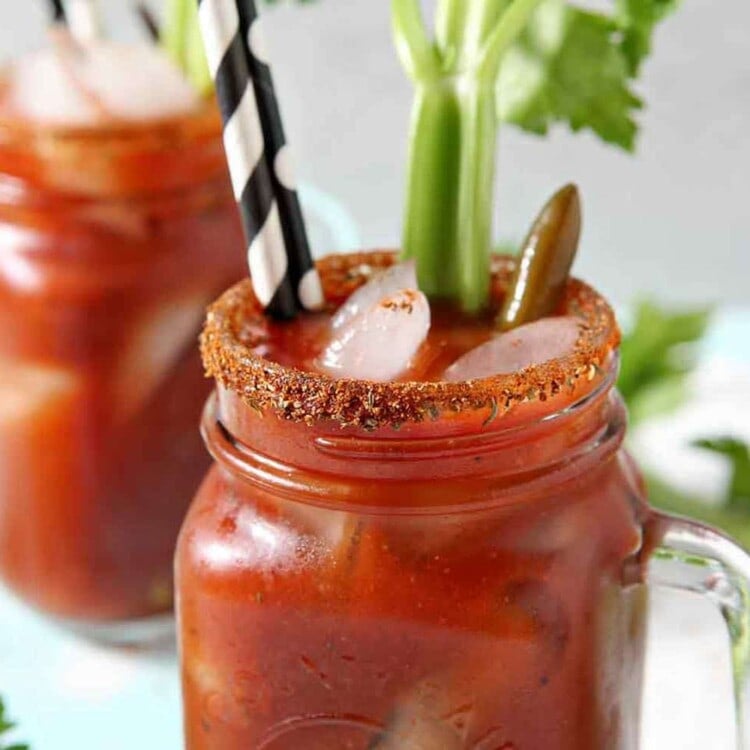 Two BBQ Bloody Marys sit next to each other on a light background