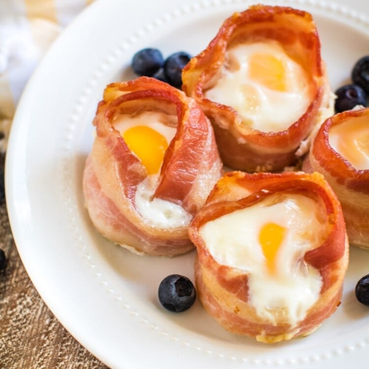 bacon and egg muffins on white plate