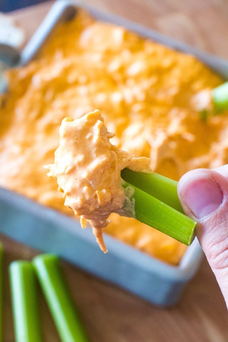 Buffalo Chicken dip on piece of celery