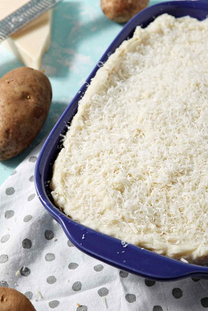 Close up of Garlic Parmesan Mashed Potato Casserole before it goes into the oven to bake