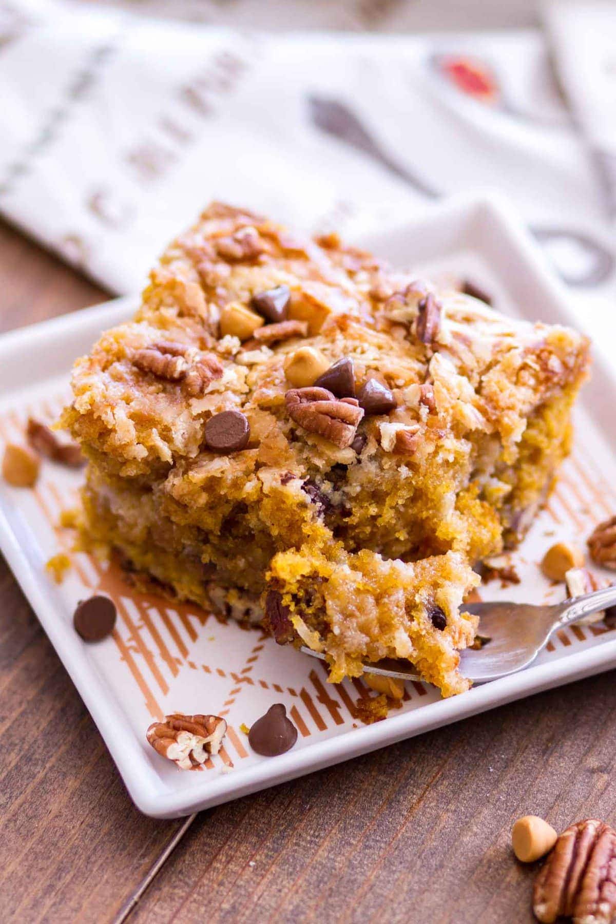 A slice of Pumpkin Earthquake Cake with a forkful serving ready to eat!