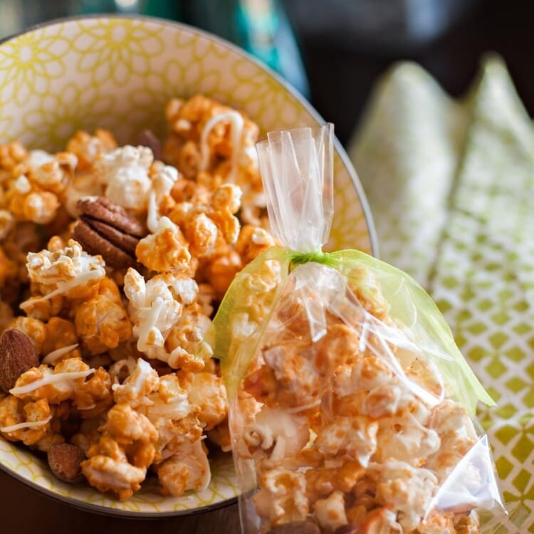Butterscotch popcorn in a bowl and in a plastic bag
