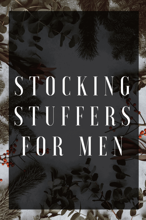 Text reading stocking stuffers for men with a background of tree branches