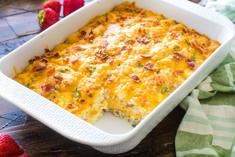 Tater Tot Sausage Breakfast Casserole in white baking dish