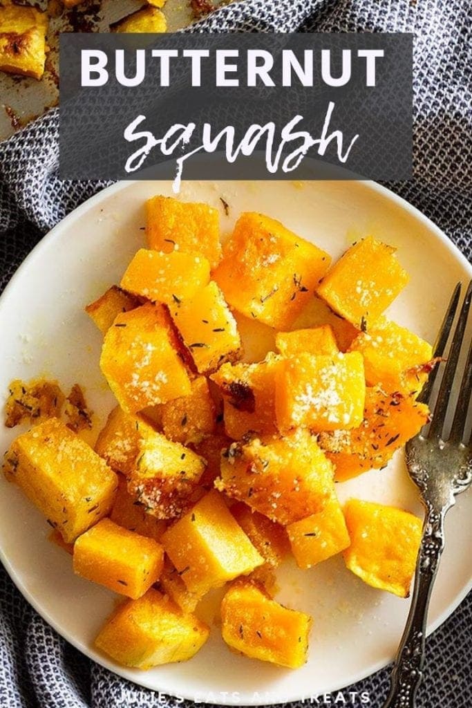 Roasted butternut squash with parmesan on a white plate