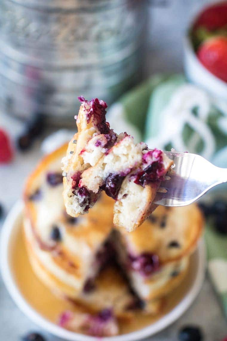 bite of blueberry pancakes on fork