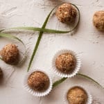 Balls of Almond Chocolate Meltaways on a white board.