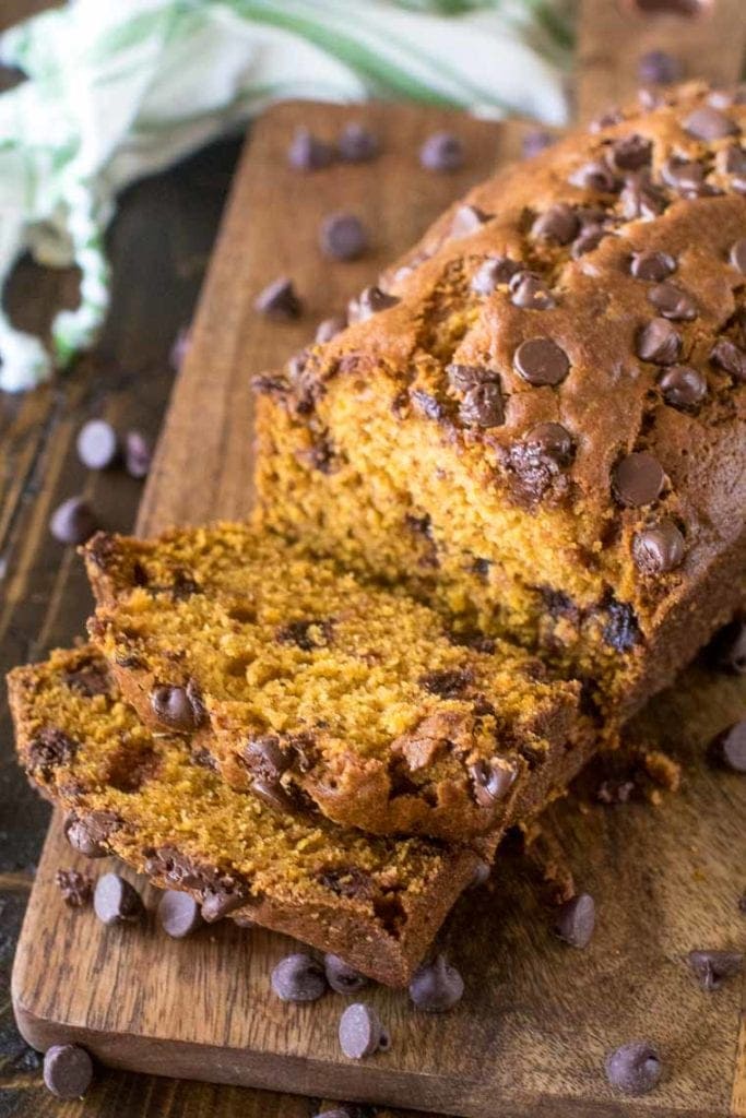 Pumpkin Chocolate Chip Bread sliced on wood cutting board