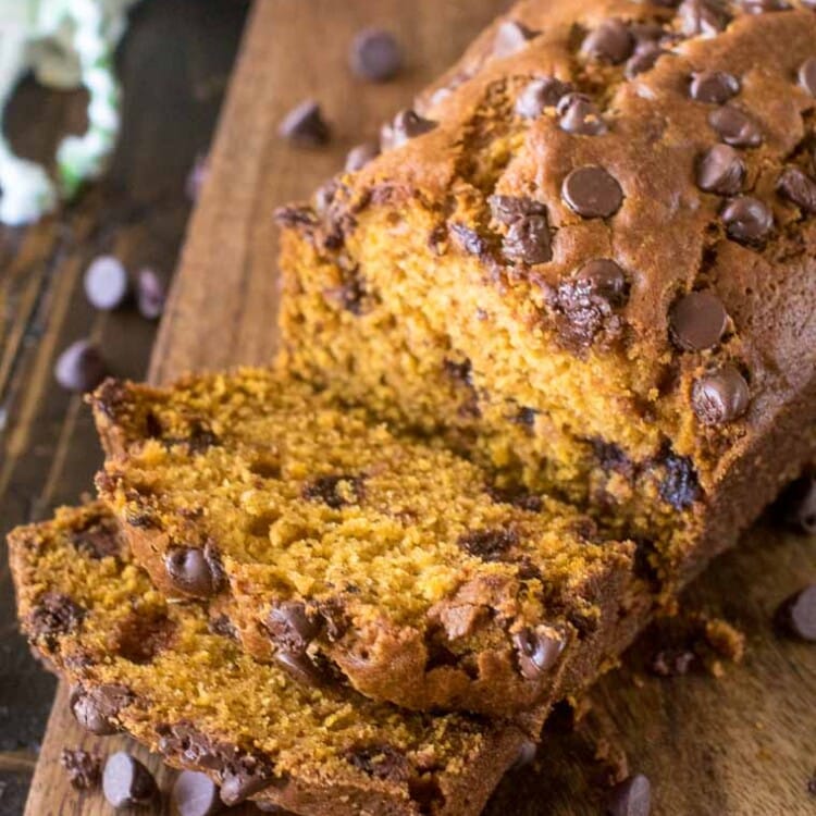 Pumpkin Chocolate Chip Bread sliced on wood cutting board