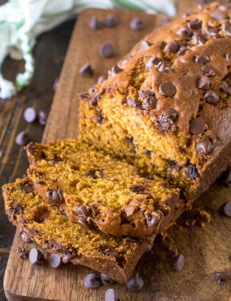 Pumpkin Chocolate Chip Bread sliced on wood cutting board