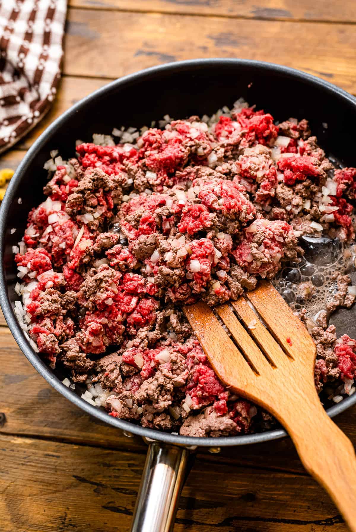 Skillet with ground beef being browned