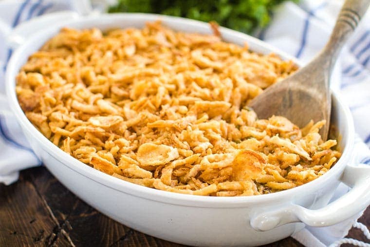 Green Bean Casserole Recipe in white baking dish with spoon