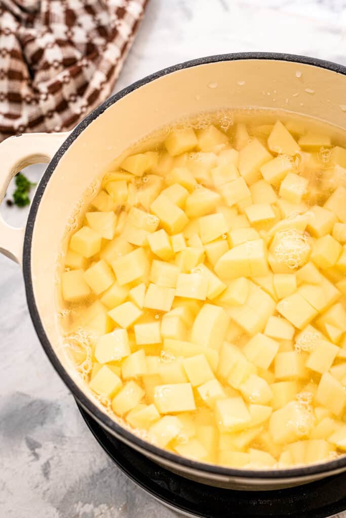 Dutch oven with diced potatoes in water