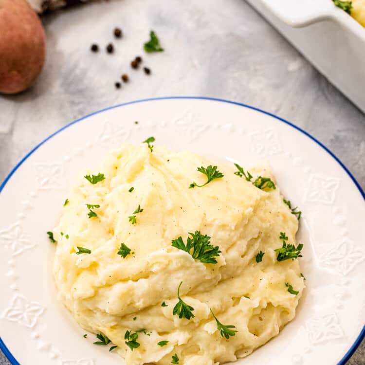 White plate with mashed potatoes on it