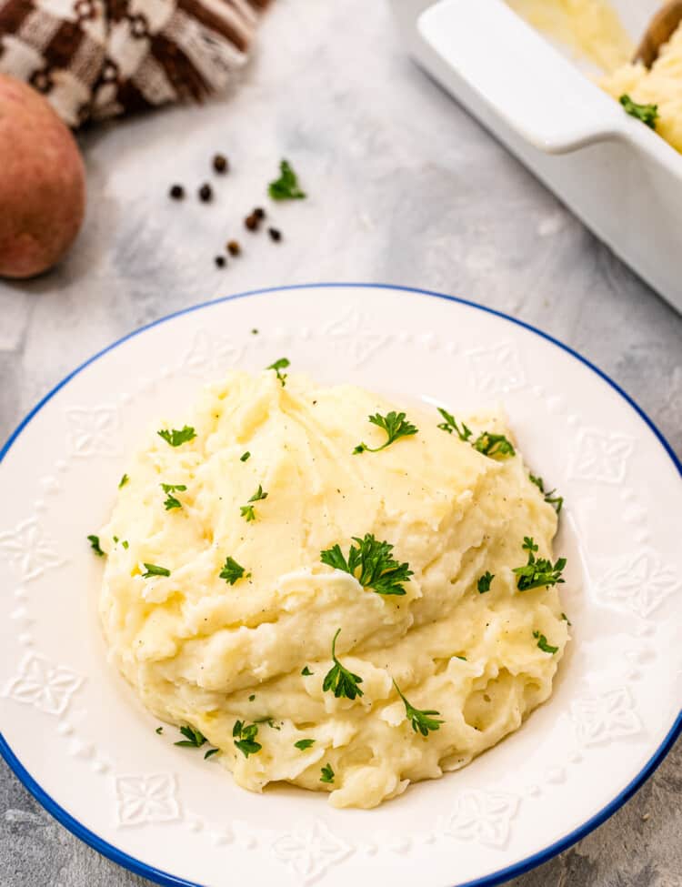 White plate with mashed potatoes on it