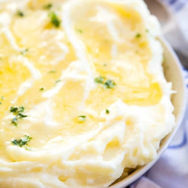 Mashed Potatoes in bowl with melted butter