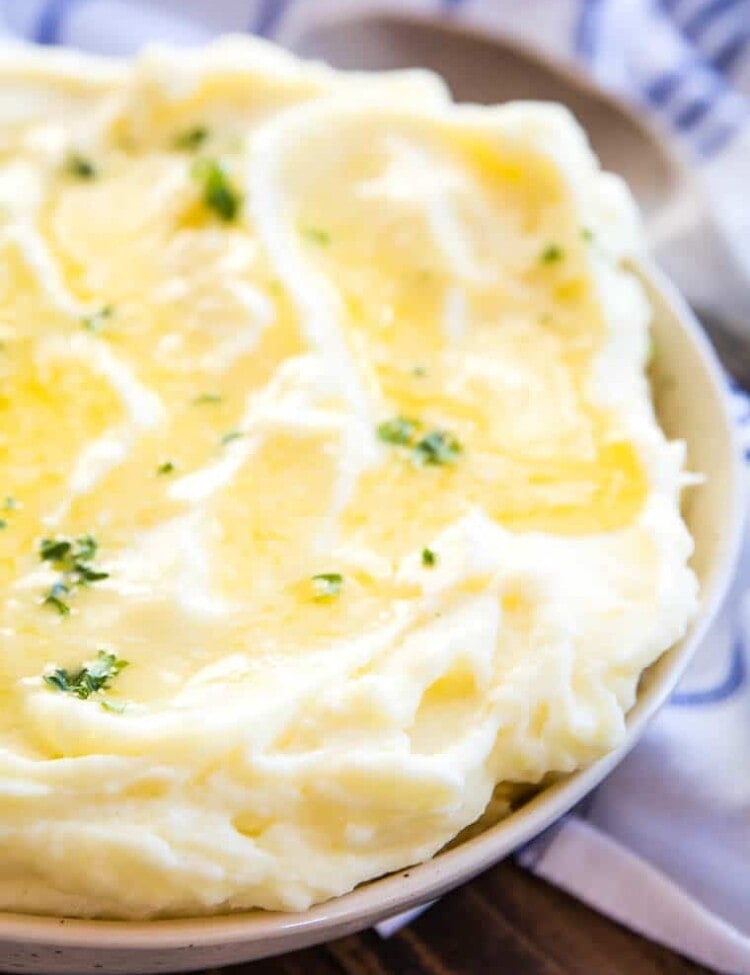Mashed Potatoes in bowl with melted butter