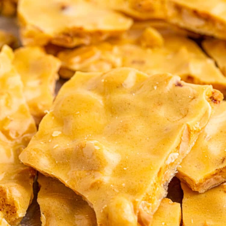 Microwave Peanut Brittle stacked on a pan